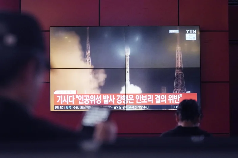 TV screen shows north koreas rocket launch at a bus terminal, 27 May 2024