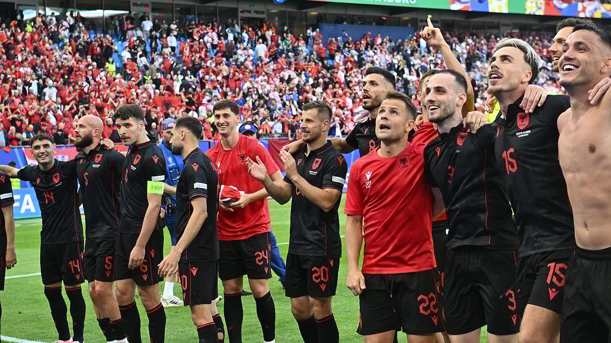 File : Albania's players celebrate after Klaus Gjasula's equaliser clinches a point against Croatia.