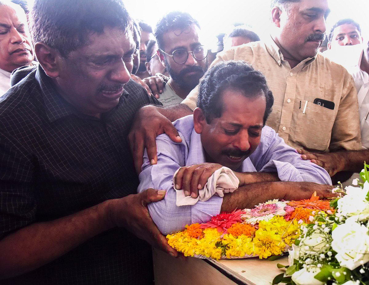 - PTI : Father Abraham mourns near the mortal remains of Sib who was killed in a fire incident in Kuwait, at the Cochin International Airport in Kochi, Friday, June 14, 2024. An IAF aircraft carrying the mortal remains of 45 Indians who died in building fire in Kuwait landed in Kochi at 10.30 a.m. on June 14. 