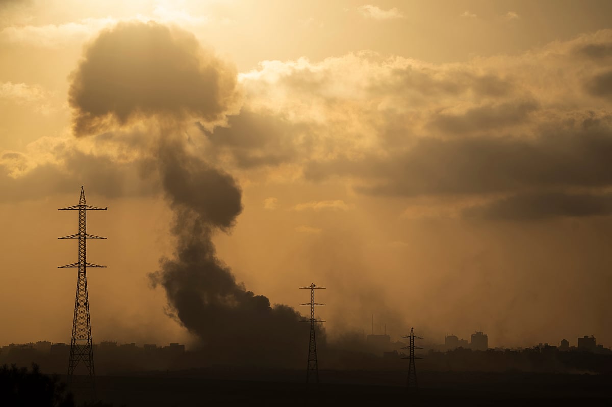AP : Smoke rises to the sky after an explosion in the Gaza Strip as seen from southern Israel. | 