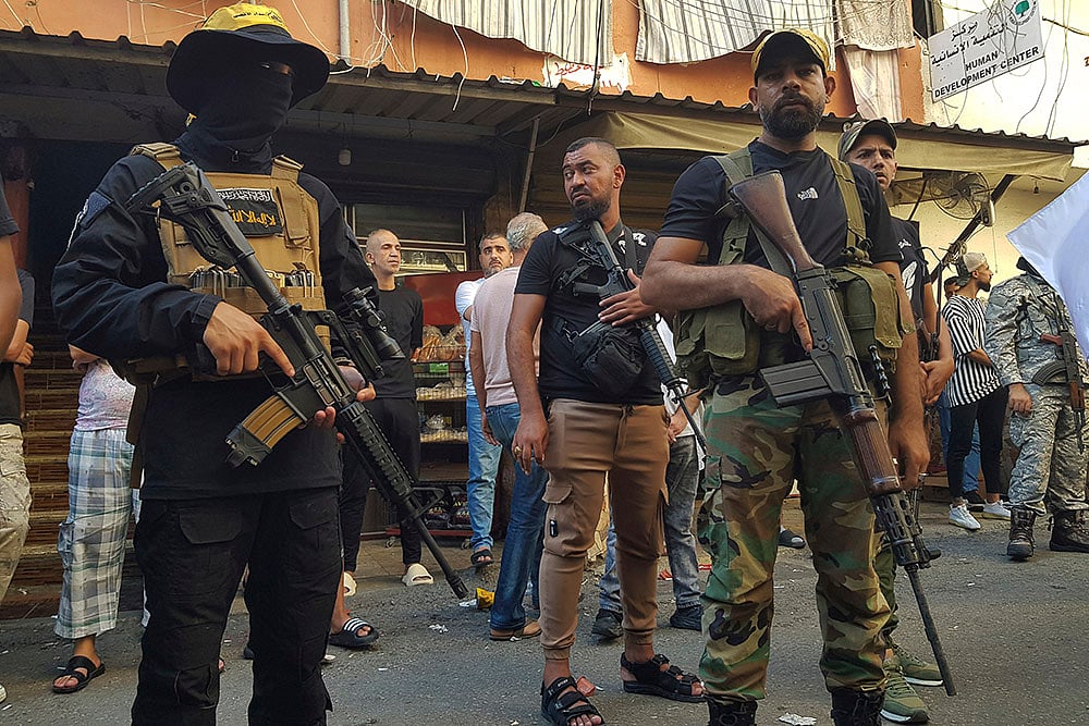 | Photo: AP/Mohammed Zaatari : Funeral procession at the Palestinian refugee camp after Israeli strike in Lebanon