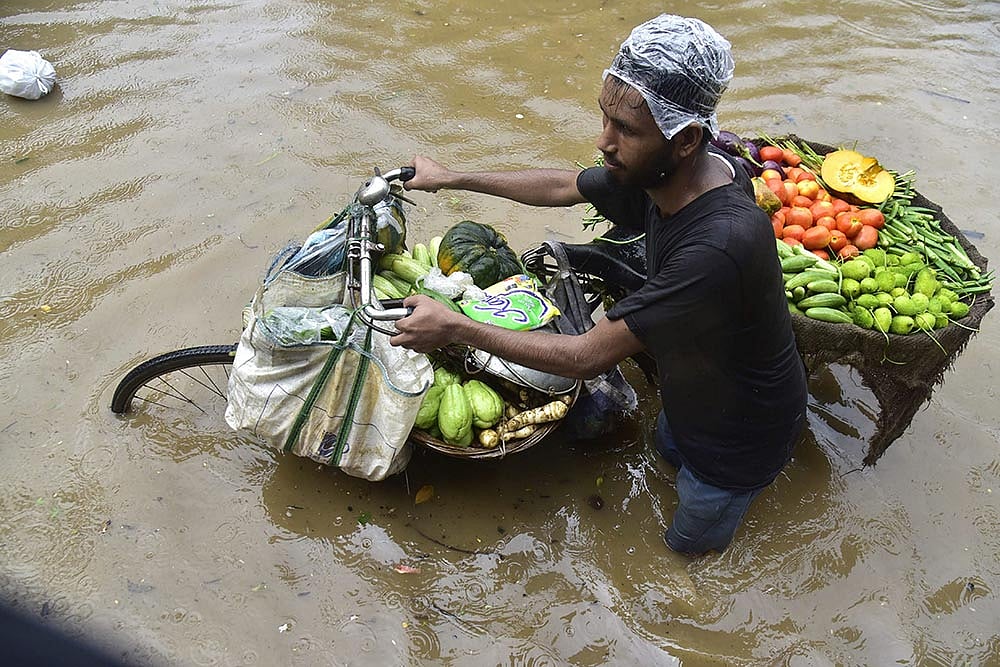 Photo: PTI : Weather: Heavy rainfall in Guwahati