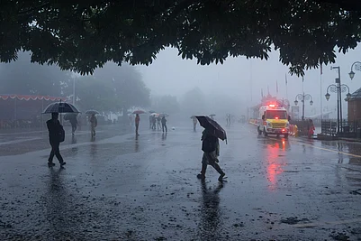 via Shutterstock : Shimla, Himachal Pradesh, India - 09:09:2023 : Rainfall in Shimla