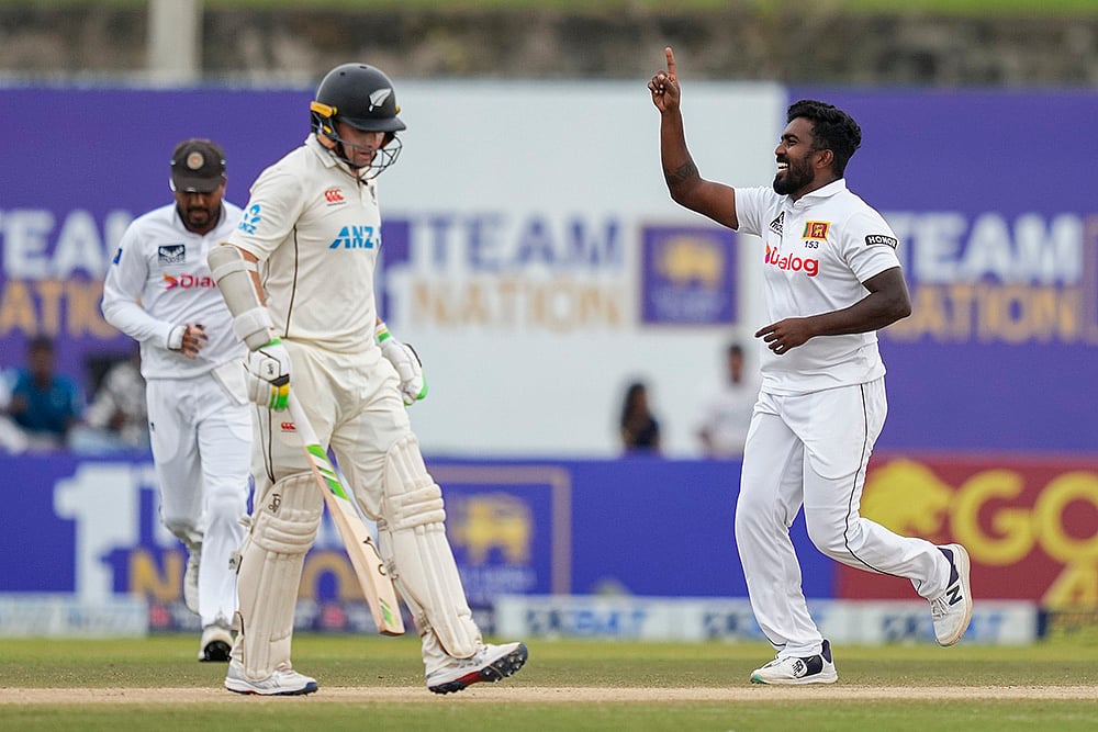 | Photo: AP/Eranga Jayawardena : Sri Lanka vs New Zealand 2nd Test: Sri Lankas Asitha Fernando celebrates the wicket of New Zealands Tom Latham 