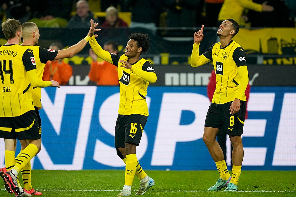 | Photo: AP/Martin Meissner : German Bundesliga 2024-25, Borussia Dortmund vs VfL Bochum: Dortmunds Felix Nmecha, right, celebrates after scoring his sides fourth goal 