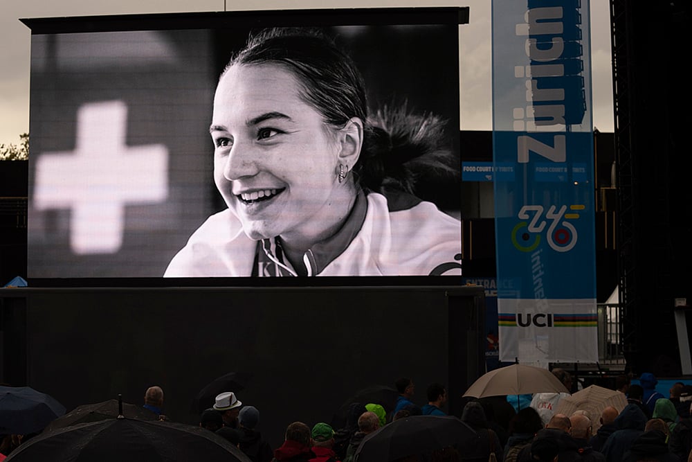 | Photo: AP/Peter Dejong : Swiss cyclist Muriel Furrer: A picture of cyclist Muriel Furrer from Switzerland who died after a crash is projected during a minute of silence