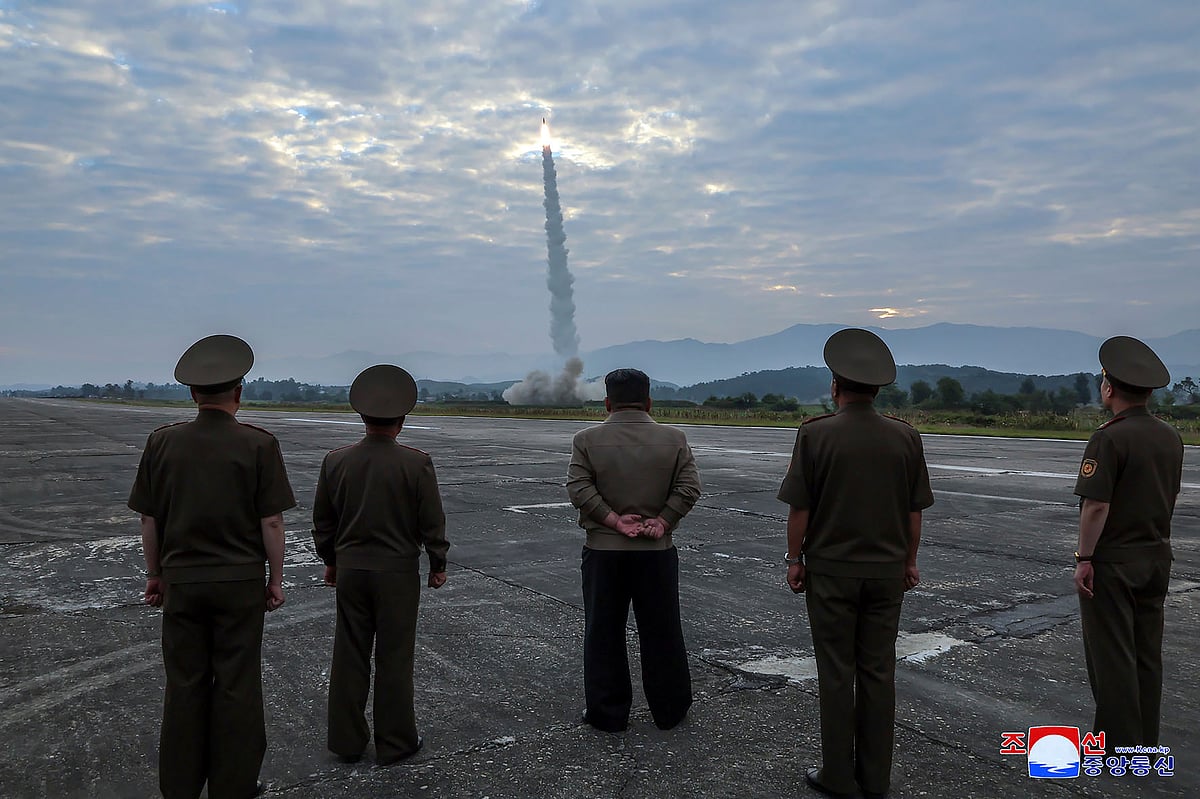 AP : In this photo provided by the North Korean government, North Korean leader Kim Jong Un, center, oversees a launch of, what it says, the country’s newly built Hwasongpho-11-Da-4.5 ballistic missile at an undisclosed place in North Korea Wednesday, Sept. 18, 2024