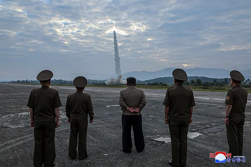 AP : In this photo provided by the North Korean government, North Korean leader Kim Jong Un, center, oversees a launch of, what it says, the country’s newly built Hwasongpho-11-Da-4.5 ballistic missile at an undisclosed place in North Korea Wednesday, Sept. 18, 2024