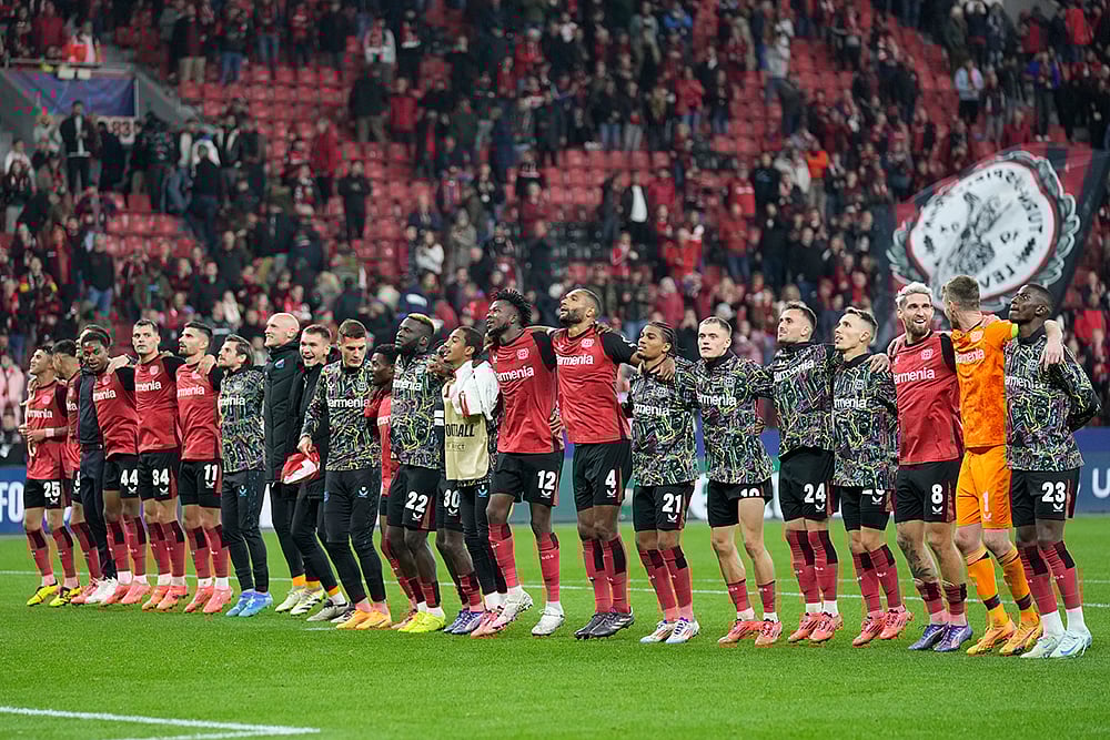 Photo: AP/Michael Probst : Bayer Leverkusen Vs AC Milan