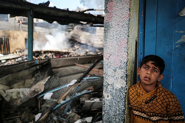 Credit: Getty Images
 : A Palestinian boy at the site of an Israeli strike on a school sheltering displaced people, amid Israel’s ongoing war on Gaza. 