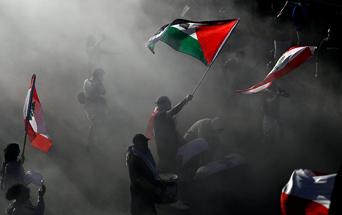 Justin Tang/The Canadian Press via AP : Pro-Palestinian demonstrators wave flags during in a rally in Ottawa, Ontario, Saturday, Oct. 5, 2024, days before the one-year anniversary of Hamas attack in southern Israel and Israels response to go to war on Hamas