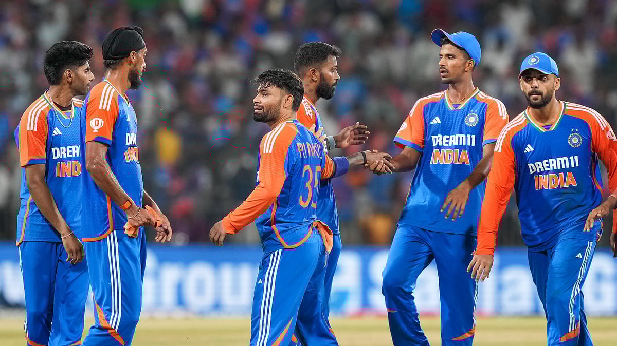 PTI Photo/Arun Sharma : Indias Arshdeep Singh celebrates with teammates after taking the wicket of Bangladeshs Mustafizur Rahman during the first T20 International cricket match between India and Bangladesh.