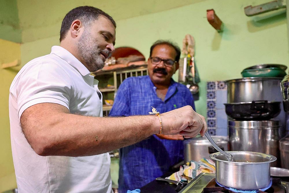 Photo: PTI : Rahul Gandhi visits Dalit family