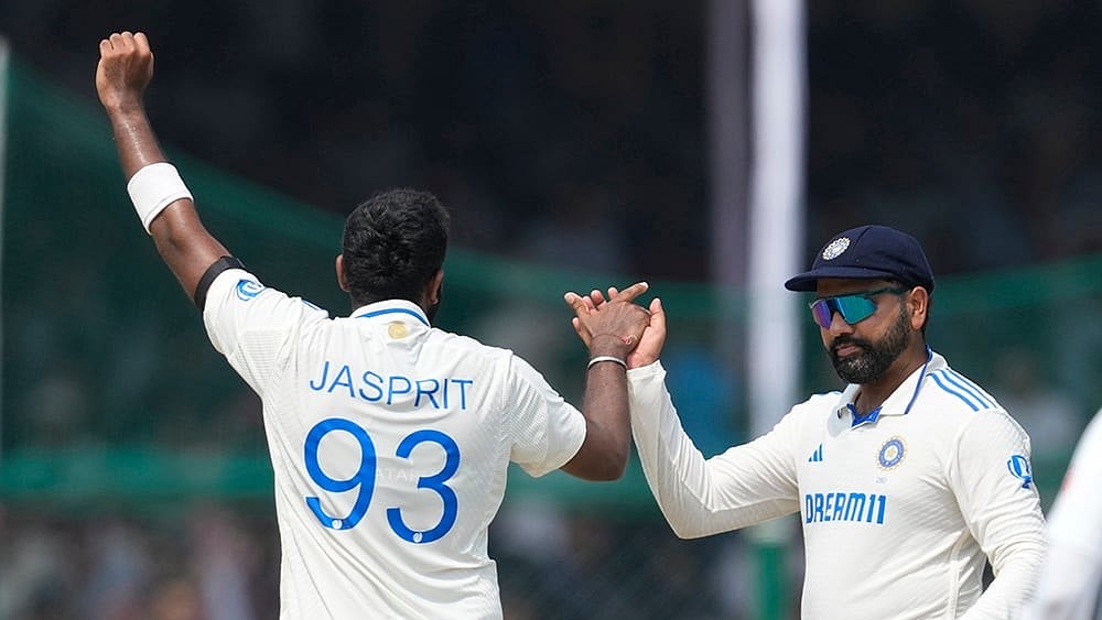 | Photo: AP/Ajit Solanki : IND vs BAN, 2nd Test: Indias Jasprit Bumrah, left, and Indias captain Rohit Sharma celebrate the wicket of Bangladeshs Taijul Islam