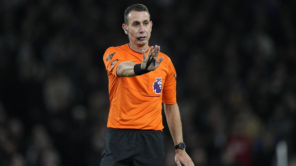 AP : File photo of referee David Coote officiating during an English Premier League match.