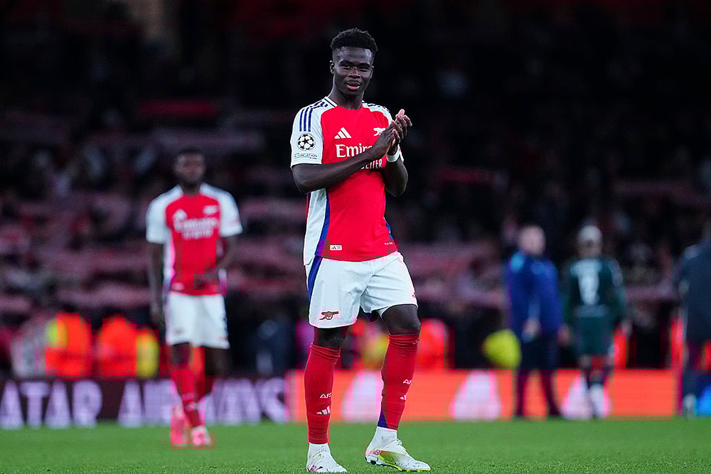 | Photo: AP/Dave Shopland : UEFA Champions League: Arsenals Bukayo Saka claps hands to spectators after the end of the match