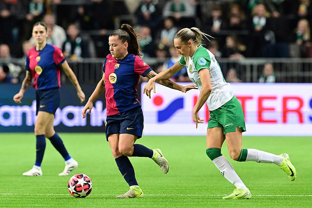 | Photo: Jonas Ekströmer/TT via AP : Womens Champions League: Barcelonas Clàudia Pina and Hammarbys Ellen Wangerheim in action
