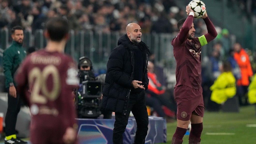AP/Luca Bruno : Manchester City's head coach Pep Guardiola instructs his players during the Champions League match against Juventus.
