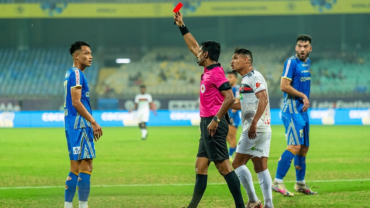 Photo: ISL/FSDL : Aibanbha Dohling (left) is shown the red card during the Indian Super League game between Kerala Blasters and NorthEast United FC.