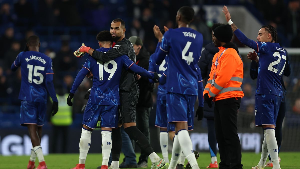 Sanchez is embraced by Jadon Sancho after Chelsea's win over Wolves