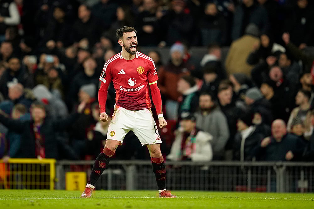 | Photo: AP/Dave Thompson : Europa League 2024-25: Man United's Bruno Fernandes celebrates after scoring his side's second goal