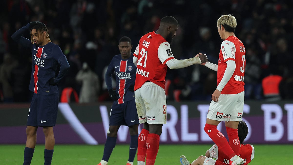 Reims players shake hands after holding PSG to a 1-1 draw