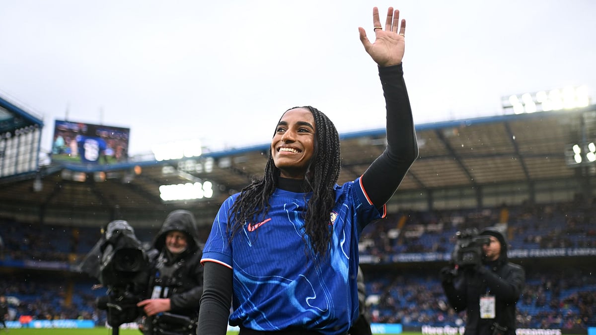 Naomi Girma salutes the Chelsea fans at Stamford Bridge