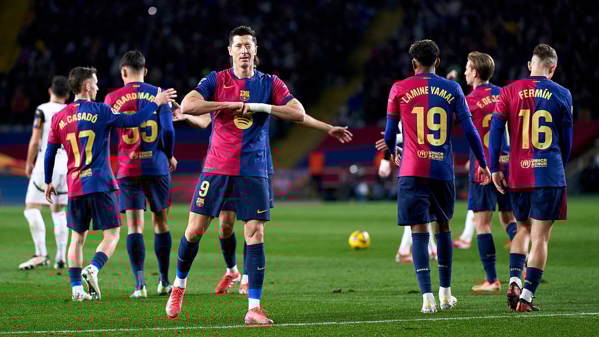 Robert Lewandowski celebrates his goal against Valencia