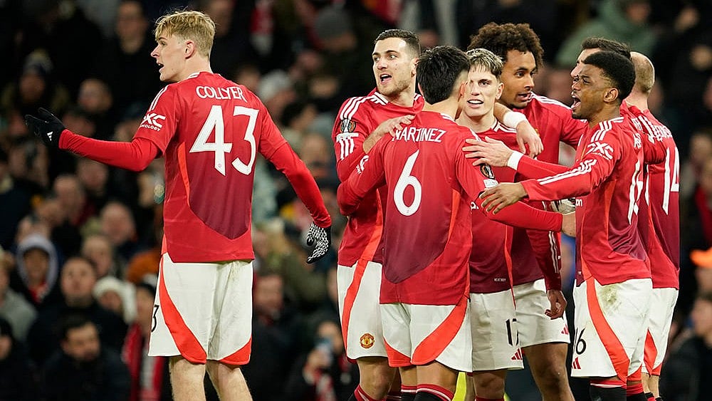 | Photo: AP/Dave Thompson : Europa League 2024-25: Manchester United's players celebrate after Rangers' goalkeeper Jack Butland scored an own goal
