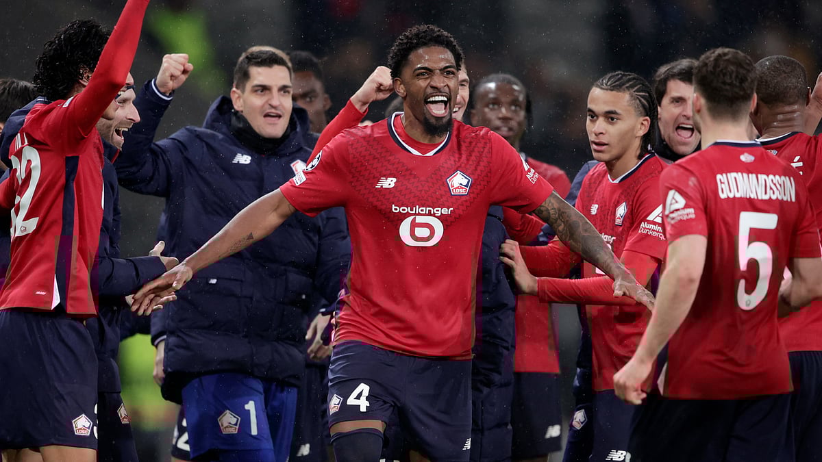 Lille's players celebrate their huge win over Feyenoord.