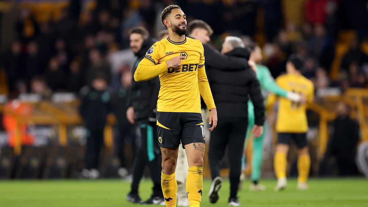 Matheus Cunha points to the Wolves badge after Saturday's win