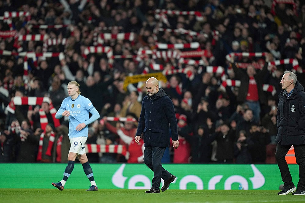 | Photo: AP/Alastair Grant : English Premier League 2024-25: Manchester City's head coach Pep Guardiola and Erling Haaland leave the pitch