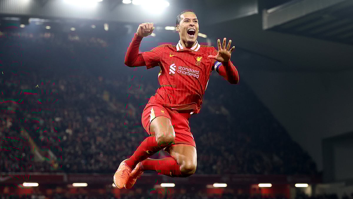 Virgil van Dijk celebrates after scoring against Tottenham