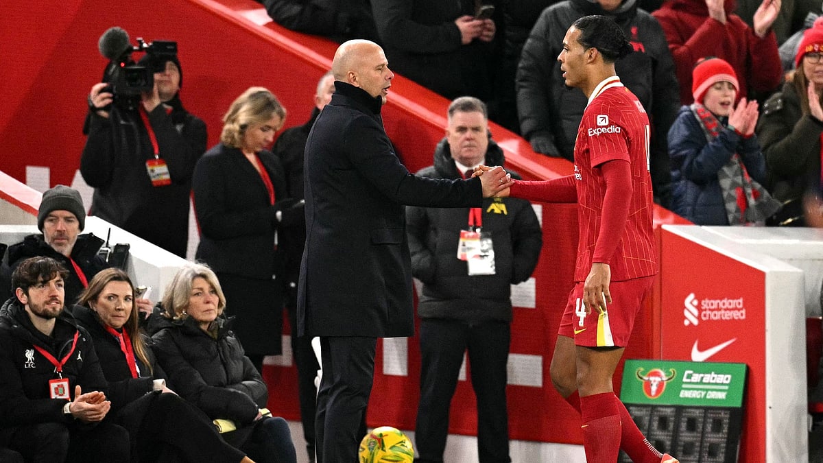 Liverpool manager Arne Slot with captain Virgil van Dijk