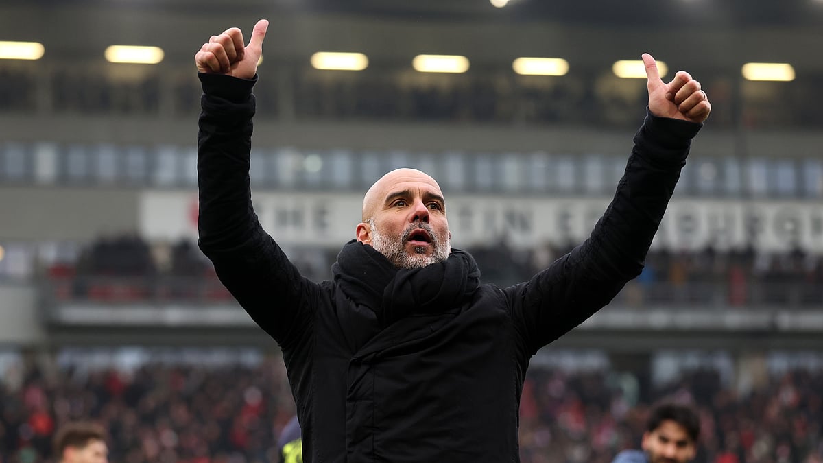 Pep Guardiola celebrates Manchester City's win over Leyton Orient in the FA Cup