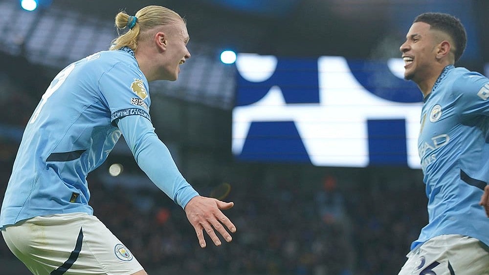 | Photo: AP/Ian Hodgson : EPL 2024-25: Manchester City's Erling Haaland is congratulated by Savinho after scoring his side's 2nd goal
