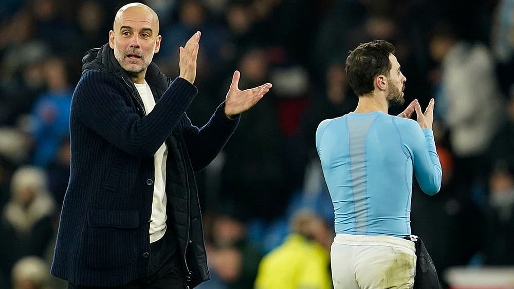 | Photo: AP/Dave Thompson : Champions League 2024-25: Pep Guardiola celebrates with Bernardo Silva 