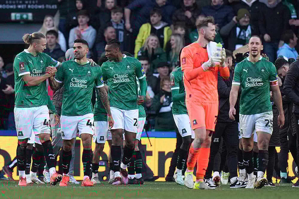 | Photo: AP/Alastair Grant : FA Cup Fourth Round: Plymouth's players celebrate after the match