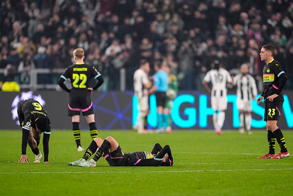 | Photo: Fabio Ferrari/LaPresse via AP : Champions League playoff first leg: PSV players look dejected after losing the match