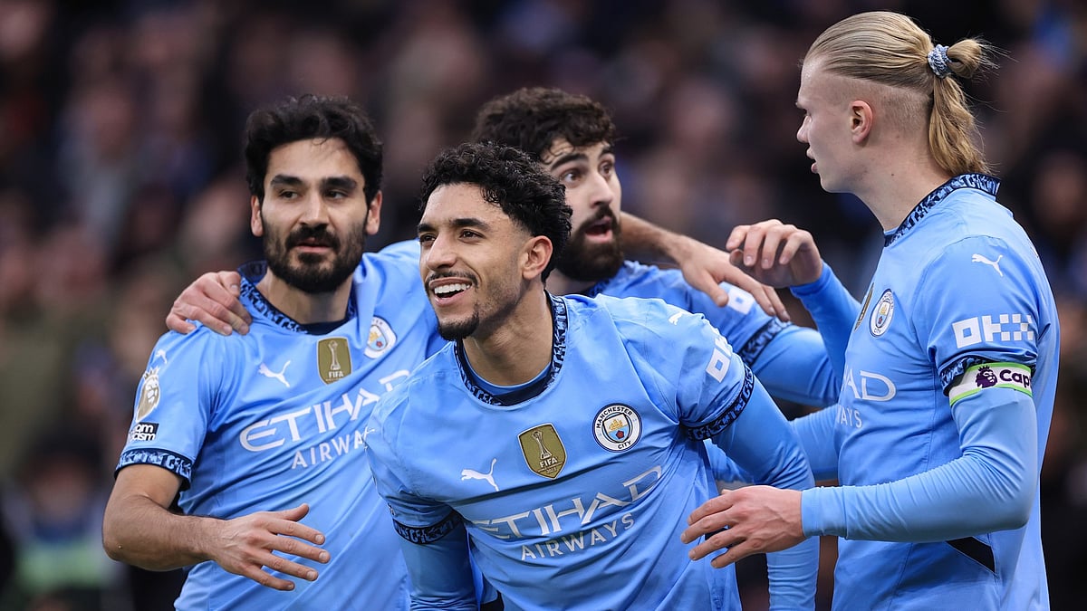 Omar Marmoush celebrates his hat-trick.