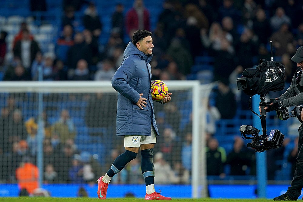 | Photo: AP/Ian Hodgson : Premier League 2024-25: Manchester City's Omar Marmoush walks away with the ball of the match for scoring a hat trick