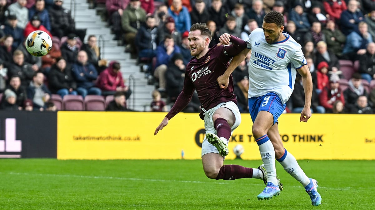 McCart scores his second own-goal under pressure from Dessers.