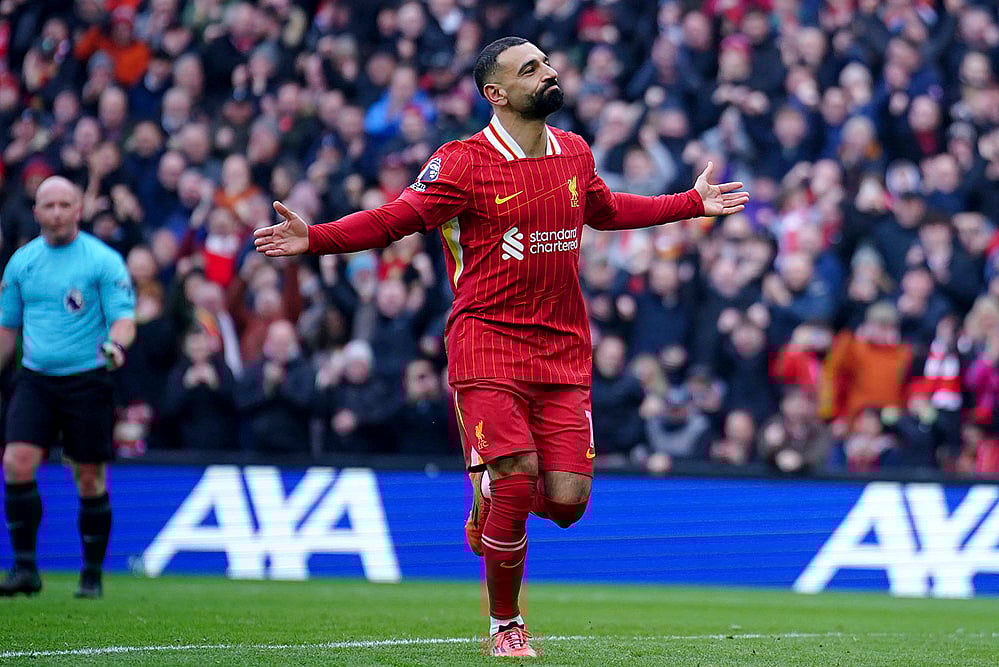 | Photo: Peter Byrne/PA via AP : EPL 2024-25: Liverpool's Mohamed Salah celebrates after scoring his side' second goal 