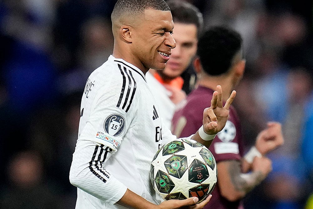 | Photo: AP/Manu Fernandez : Champions League playoff second leg: Real Madrid's Kylian Mbappe gestures as he leaves the pitch with the match ball 