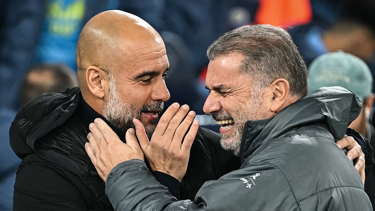 Manchester City manager Pep Guardiola with Tottenham manager Ange Postecoglou