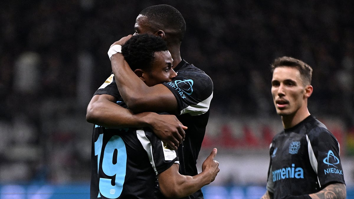 Bayer Leverkusen's players celebrate Nordi Mukiele's goal