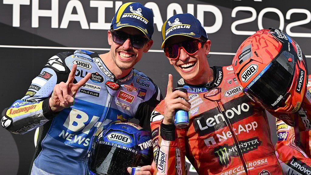 AP : Winner Marc Marquez, right, and second-placed Alex Marquez celebrate on the podium after the Thai MotoGP race. 