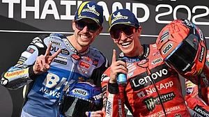 AP : Winner Marc Marquez, right, and second-placed Alex Marquez celebrate on the podium after the Thai MotoGP race.