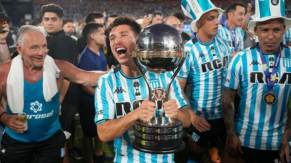 | Photo: AP/Jorge Saenz : Copa Sudamericana  Racing Club players celebrate with the trophy after winning the Copa Sudamericana final