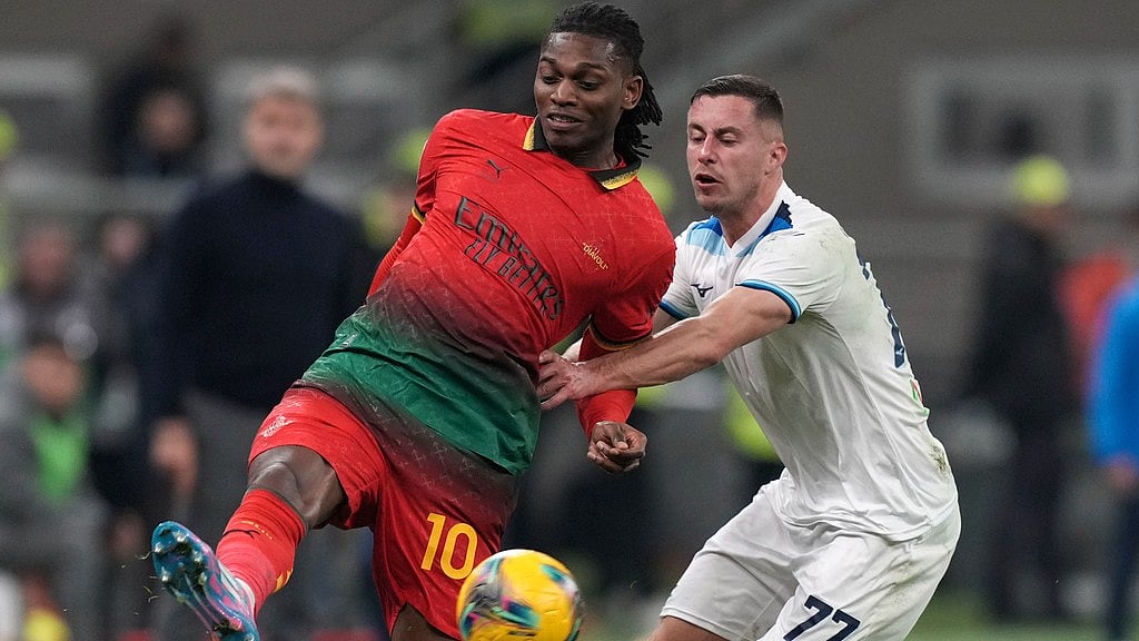 Photo: AP : Lazio's Adam Marusic, right, challenges AC Milan's Rafael Leao during their Serie A match at the San Siro stadium.